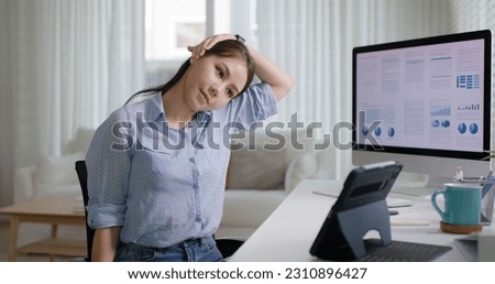 Asia people young woman worker work at home job video call telemedicine online clinic app for workforce care meet chat or tele consult to doctor remote advice teach to relax stiff neck or wrist pain. Royalty-Free Stock Photo #2310896427
