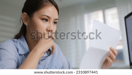 Young sad shock job lost woman worry upset tired read office bad news cruel mail reduce staff by unfair lay off break cancel stop work at home. Labor workforce crisis in asia worker people SME issue. Royalty-Free Stock Photo #2310897441