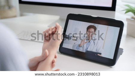 Asia people young woman worker work at home job video call telemedicine online clinic app for workforce care meet chat or tele consult to doctor remote advice teach to relax stiff neck or wrist pain. Royalty-Free Stock Photo #2310898013