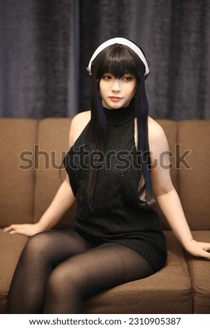 Portrait of a beautiful young woman Cosplay with black sweater