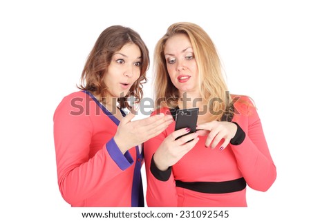 two pretty young girls speaking by mobile phone