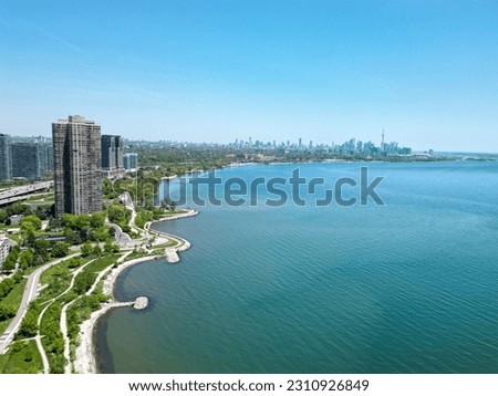 Toronto Skyline at Etobicoke Lakeshore: A Breathtaking Aerial View of the Vibrant Cityscape Reflecting on the Tranquil Waters of Lake Ontario. 