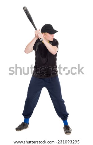 Young sportsman with a bat for baseball swings to strike