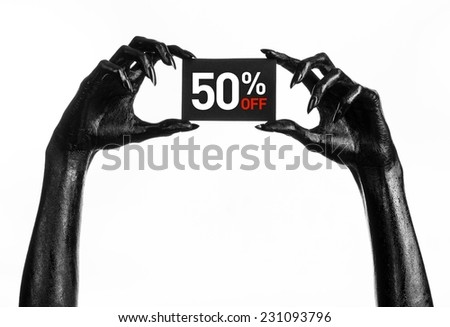 Hot sale topic: black hand holding a card with a 50% discount on white background