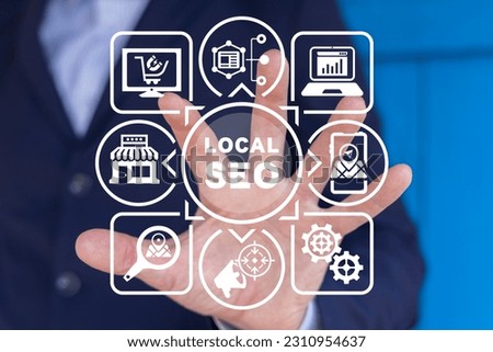 Man using virtual touchscreen sees inscription: LOCAL SEO. Local search marketing e-commerce. Concept of local seo strategy, local search optimization. Royalty-Free Stock Photo #2310954637