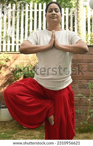 An Indian woman doing yoga in the park