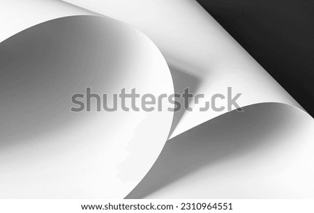 Two large sheets of white paper. Black and white image.