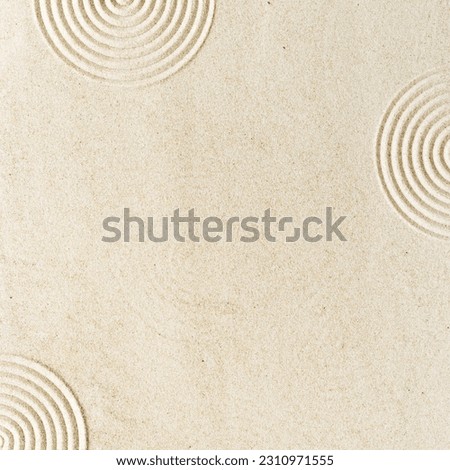 Top view pattern in Japanese Zen Garden with close up concentric circles on sand for meditation and relaxation. Aesthetic minimal sandy background with copy space, yellow beige neutral tones. 