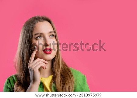 Thinking around woman on pink background. Smart student girl finding answer or trying to remember what she forgot, memory concept. High quality. Copy space Royalty-Free Stock Photo #2310975979