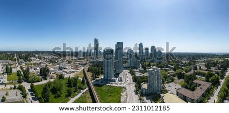 Residential Homes and Buildings near Surrey Central, Vancouver, British Columbia, Canada. Aerial Panorama Royalty-Free Stock Photo #2311012185