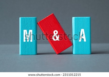M and A - Mergers and Acquisitions, word concept on building blocks, text, letters
