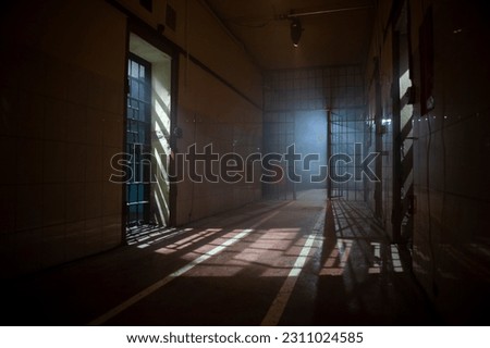 Prison corridor. Dark corridors in the prison.  Royalty-Free Stock Photo #2311024585