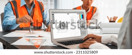 Engineer and architect working together brainstorming and designing blueprint using laptop working with architectural software for precise digital interior or structure design. Insight Royalty-Free Stock Photo #2311025809