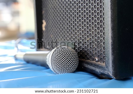 microphone and speakers on blue background