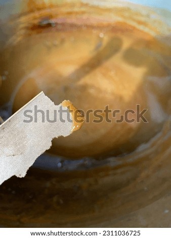 The process of stirring Toddy palm sugar  Royalty-Free Stock Photo #2311036725