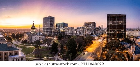 Aerial view of the South Carolina skyline at dusk in Columbia, SC. Columbia is the capital of the U.S. state of South Carolina and serves as the county seat of Richland County Royalty-Free Stock Photo #2311048099