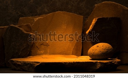 podium stones for product presentation background on orange gold background. brown stones with texture in composition for podium background.