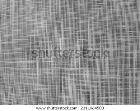 Pattern of woven cloth with very small checkered pattern in brown.