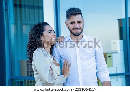 Valentine's Day. Young loving couple exchanging affection on the street. Loving couple on outdoor background