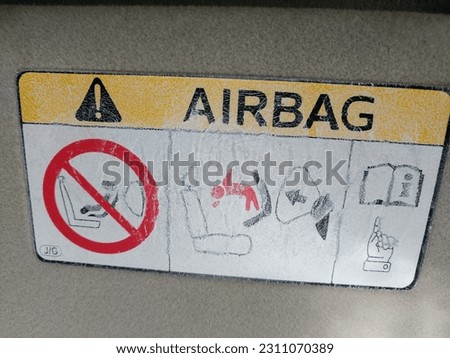 AIRBAG signed dangerous alert. People's do alerts on this sign in car