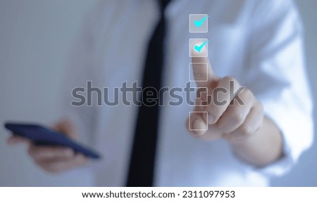 Businessman writing or making valid marks to approve documents and project ideas	