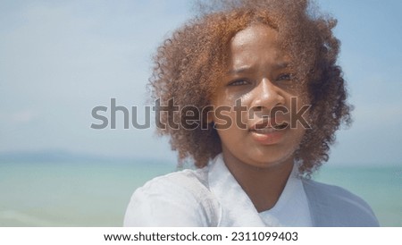 Young women play in the sea on their summer vacation and they smile and are happy on vacation