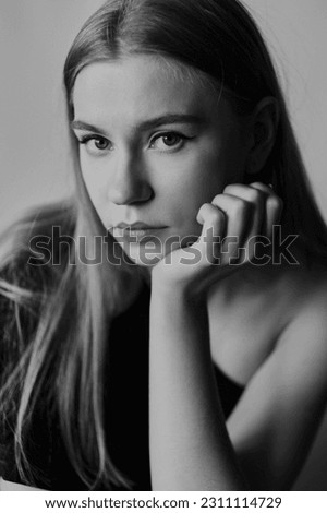 Black and white portrait of a young woman with natural makeup and natural styling.Advertising natural cosmetics.Advertising for a beauty salon. High quality photo