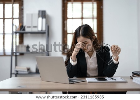 Tired stressful Businesswoman eyestrain after work, overworked.
 Royalty-Free Stock Photo #2311135935