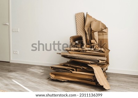 Stack of Cardboard Waste with PAP 21 symbol. Concepts of Paper Recycling and Waste Sorting. Royalty-Free Stock Photo #2311136399