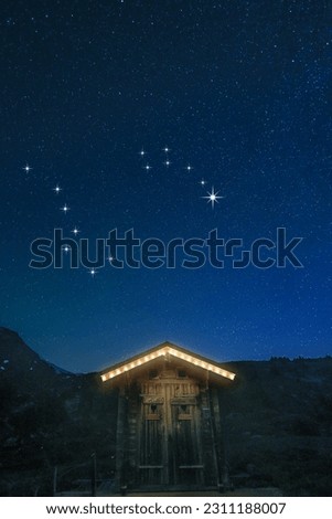A real night scene on a mountain hut with starry sky showing constellation of big dippper and little dipper and the North Star - Month May in North sphere Royalty-Free Stock Photo #2311188007