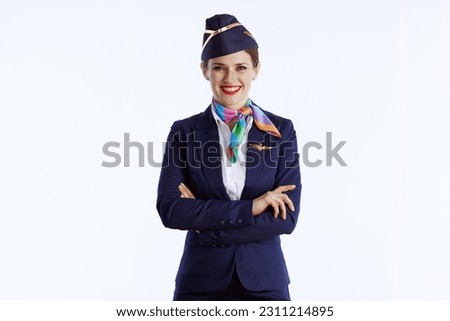 smiling stylish female air hostess isolated on white background in uniform. Royalty-Free Stock Photo #2311214895