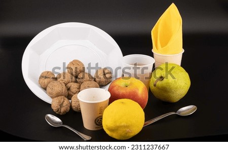 still life breakfast with fruit, dried fruit, tea and coffee