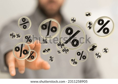 The male man's hand touching the virtual percentage icons with his fingers. Sale concept
