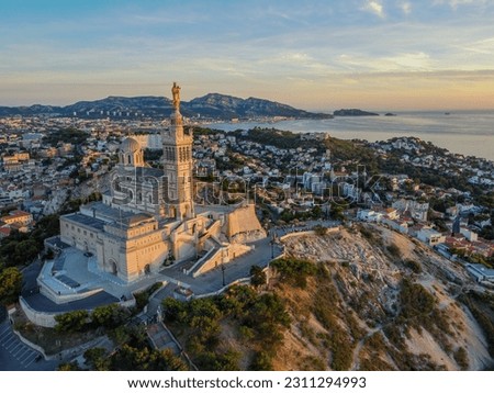 Aero Photography. View from flying drone. Old city center and aaport of Marseille (Vieux-Port de Marseille) and Basilique Notre-Dame de la Garde. at sunset. Top View. Beautiful destinations. Royalty-Free Stock Photo #2311294993