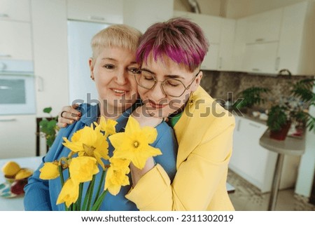 A Heartwarming Moment: Non-Binary Daughter Presents Birthday Flowers to Mother