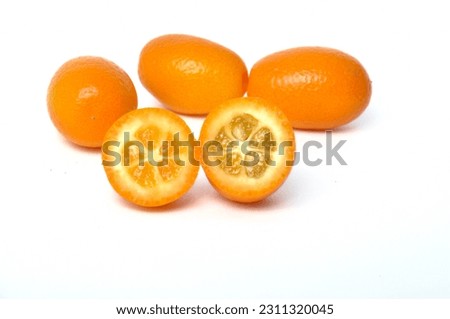 kumquat on a white background Royalty-Free Stock Photo #2311320045