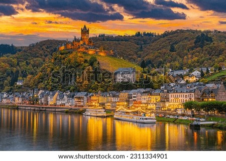 Cochem, Germany, beautiful historical town on romantic Moselle river, city view with Reichsburg castle on a hill in autumn color Royalty-Free Stock Photo #2311334901