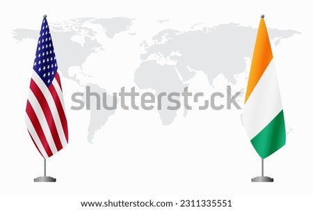 United States and Ivory Coast flags for official meeting against background of world map. Royalty-Free Stock Photo #2311335551