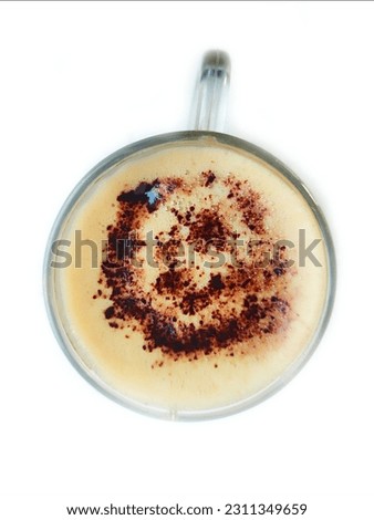 A Cup of Aromatic Cream Coffee.
This captivating close-up shot features a steaming cup of strong coffee emitting a tantalizing aroma that captivates the senses.