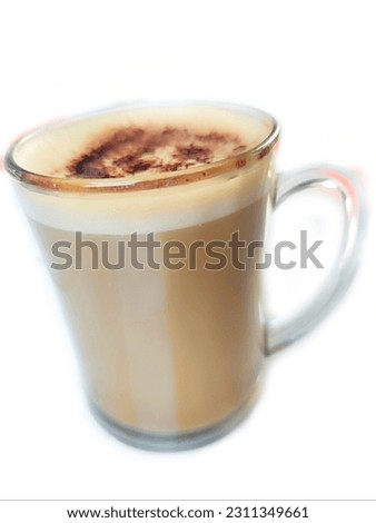 A Cup of Aromatic Cream Coffee.
This captivating close-up shot features a steaming cup of strong coffee emitting a tantalizing aroma that captivates the senses.