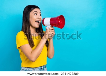Photo of young excited japanese girl hold megaphone scream loudspeaker empty space announcement isolated on blue color background Royalty-Free Stock Photo #2311427889