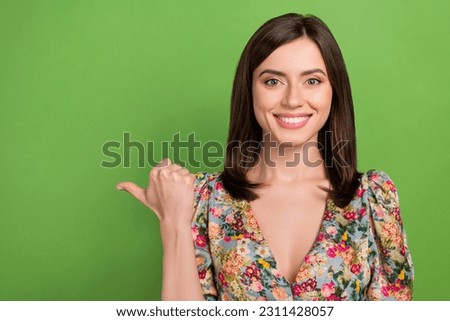 Closeup photo of pretty lady showing sale product empty space wear floral blouse top shirt isolated green color background