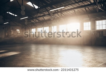 Gym, interior and empty space or dark room with window and light flare for exercise, training and fitness workout. No people, sports club and floor layout of exercising venue, facility and gymnasium Royalty-Free Stock Photo #2311431275