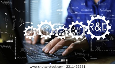 Engineers working on research and development through computer screens and gear icons as a continuous process as a process. New product development or software development concept. Royalty-Free Stock Photo #2311433331