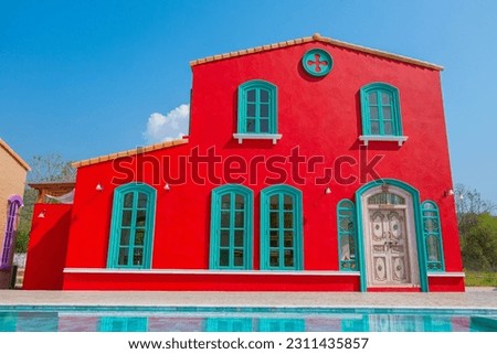 Red house with blue sky in summer.