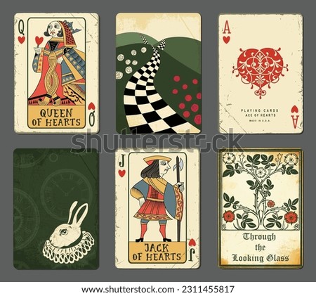 Alice in Wonderland Playing Cards illustrating novel by Lewis Carroll, including Queen, Jack and Ace of Hearts, White Rabbit and book title page Royalty-Free Stock Photo #2311455817