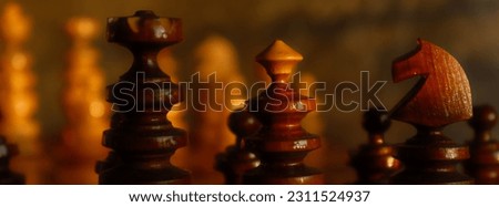 Chess - panoramic photo of pawns in warm colors.