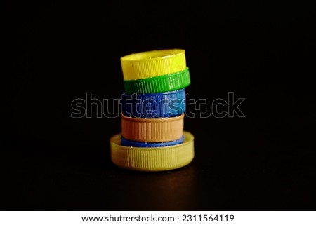 close up of bottle caps. plastic bottle cap on black background