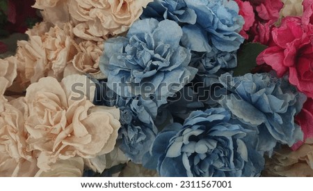 pictures of paper flowers whose colors have faded 