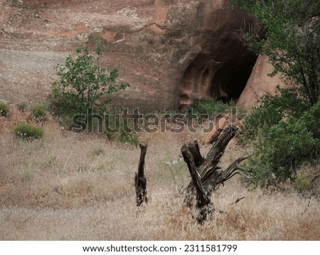 Cave in sandstone rock leads into the darkness is a caver dream